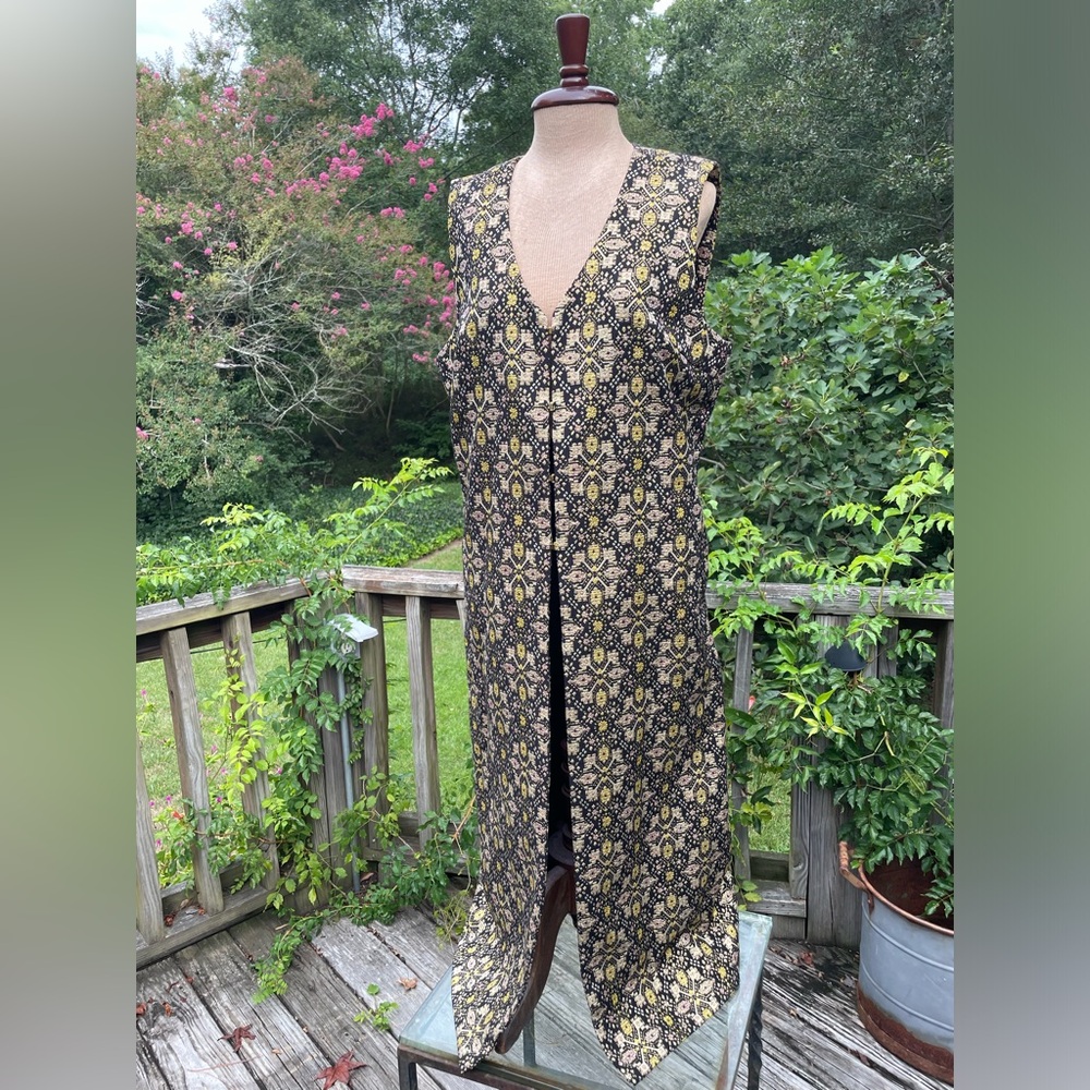 C. Wonder longline brocade vest with metallic accented fabric & gold fasteners L